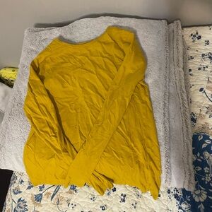 Yellow shirt that has been worn once, large.